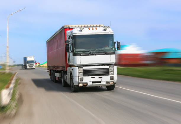 istock truck moves on highway 877396060