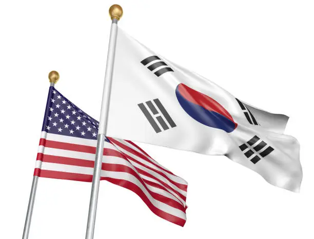 Flags from South Korea and the United States flying side by side to represent relations between the two, isolated on a white background.