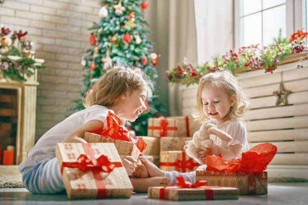 istock girls opening gifts 877407766