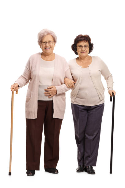istock Two elderly women with walking canes 877433578