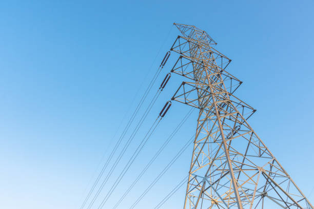 istock Electricity station. Close up high voltage power lines at sunset. 877473372