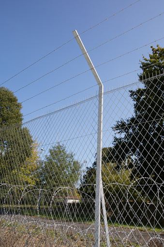 Barbed wire stretched prevent theft or malicious intrusion