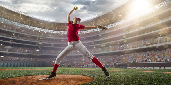 Sports, pitch and baseball ball in air, pitcher throwing it in match, game or practice in outdoor field. Fitness, exercise and training on baseball field with player in action, movement and motion