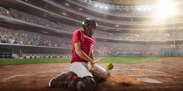 istock Softball female catcher on a professional arena 877487890
