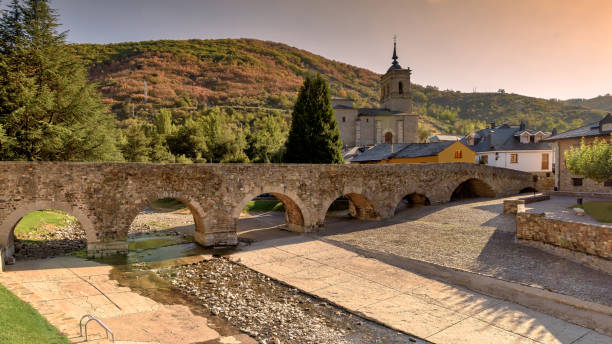 istock Dry river bed under ancient Roman bridge in St James Way, Molinaseca, Spain. 877490288