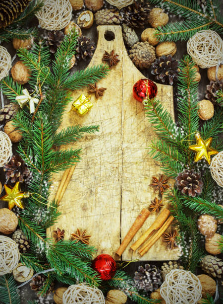 istock old cutting board with christmas attributes on a wooden kitchen background 877501400