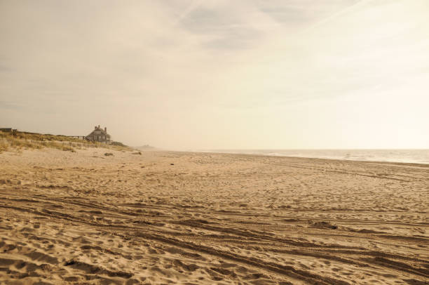 Beach on Long Island in New York in the United States Windy autumn day at the beach of Wainscott near the Hamptons on Long Island in New York. The iage expresses the atmosphere of the american east coast and the Atlantic Ocean. the hamptons stock pictures, royalty-free photos & images