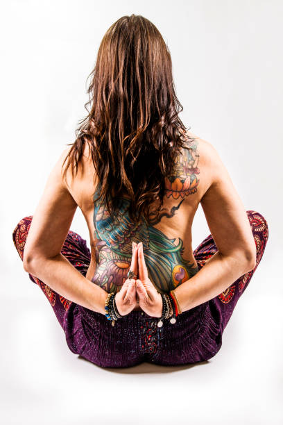 istock Middle-aged woman in her 40's practising yoga 877504546