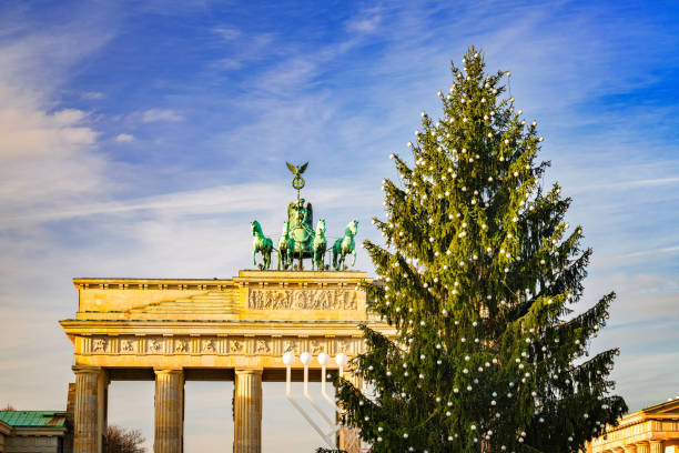 istock Brandenburg gate and christmas tree 877505218