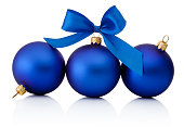 Three blue christmas baubles Isolated on white background