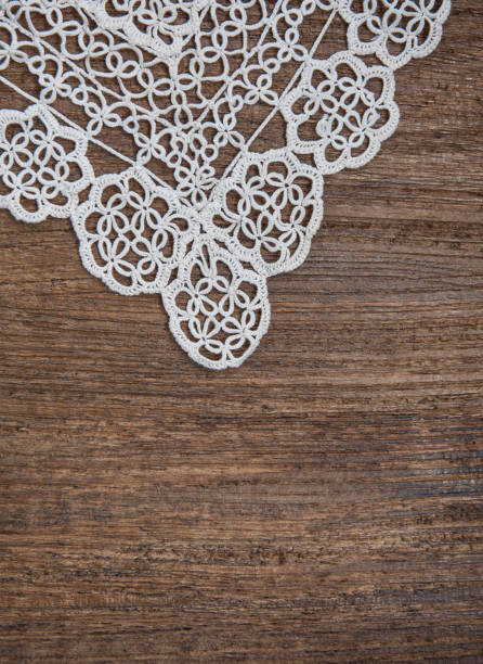 istock Vintage background with lace on the old wood 877508050
