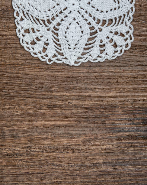 istock Vintage background with lace on the old wood 877508172