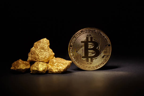 Golden Bitcoin Coin and mound of gold on black background Kiev, Ukraine - September 19, 2017: Studio shot of Golden Bitcoin Coin and mound of gold on black background. The Bitcoin was invented by Satoshi Nakamoto in 2008 as a digital form of money"nThis is a close up photo of several gold plated bitcoins together symbolizing the bit coin market, modern technology, finance, internet, trading, etc. "nBitcoin introduced in 2009 cross-national payment system in the form of virtual money, to be used in the cryptographic techniques (cryptocurrency). gold bitcoin stock pictures, royalty-free photos & images