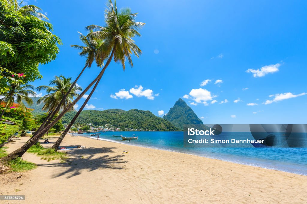 Paradise beach at Soufriere Bay with view to Piton at small town Soufriere in Saint Lucia, Tropical Caribbean Island. Paradise beach at Soufriere Bay with view to Piton at small town Soufriere in Saint Lucia, Tropical Caribbean Island. Travel destination for vacation. Beach Stock Photo