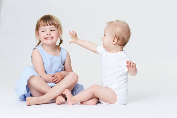 istock Baby boy and sister 877508844