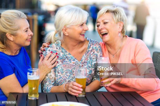 Smiling Senior Women Having A Beer In A Pub Outdoor Stock Photo - Download Image Now