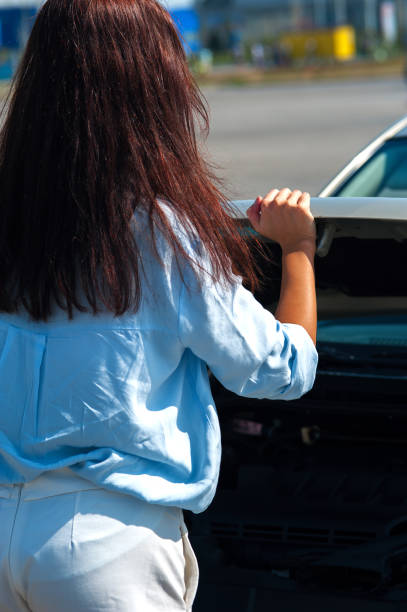 istock Beautiful woman has problem with the car 877568002
