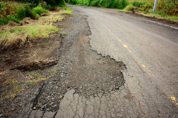 istock asphalt road break and trees beside 877593004