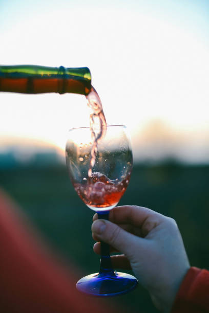 istock Red wine pouring into glass 877601198