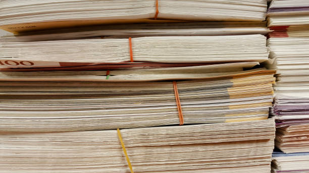 istock close up stack of paper on white background 877618196