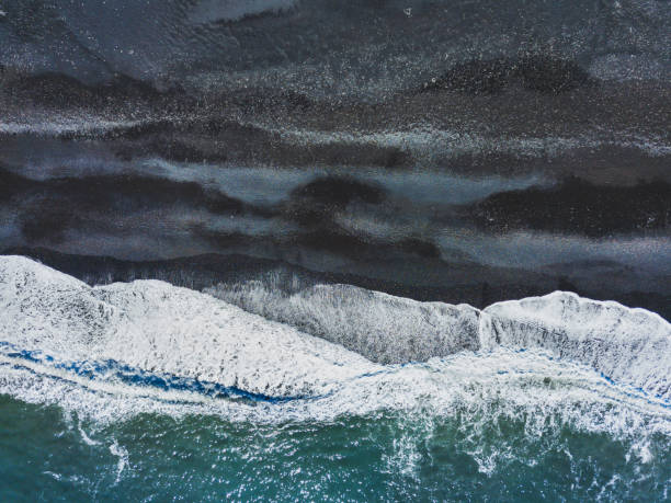 istock aerial shot of waves on black sand beach 877618352