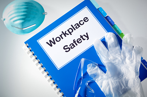 Still life of a workplace safety manual and equipment for chemical, pharmaceutical, medical, educational, research laboratory,