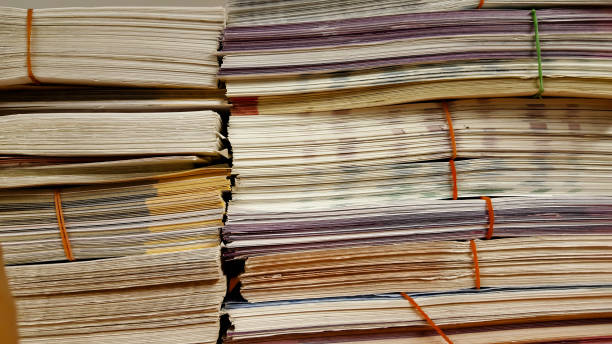 istock close up stack of paper on white background 877618580