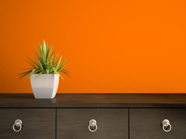 istock Part of interior with plant and orange wall 3D rendering 877625520