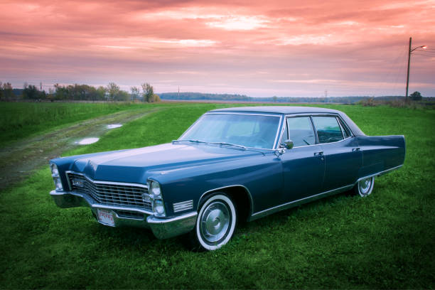 istock Old blue 1967 car parked at sunset in a field 877633836