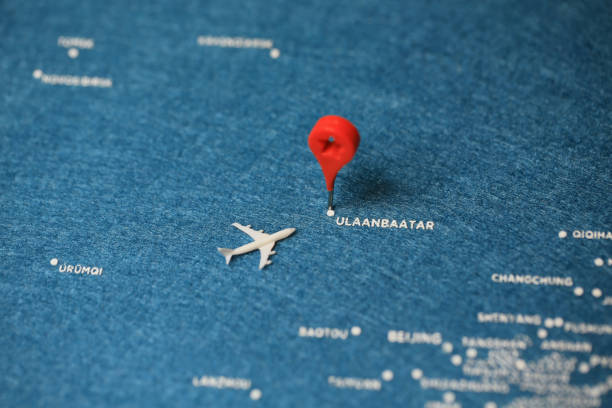 istock airplane fly on the blue painted map 877667350