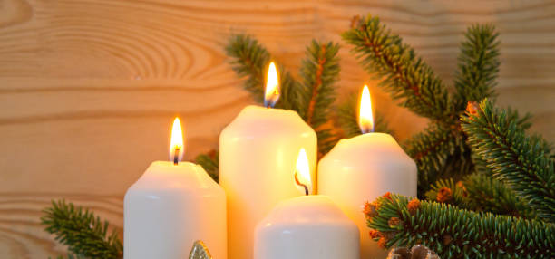 istock Christmas decoration and four burning Advent candles 877695476