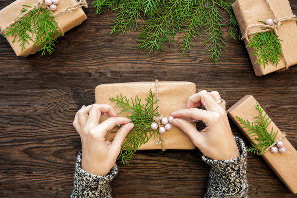 istock Female hands holding Christmas gift 877699304