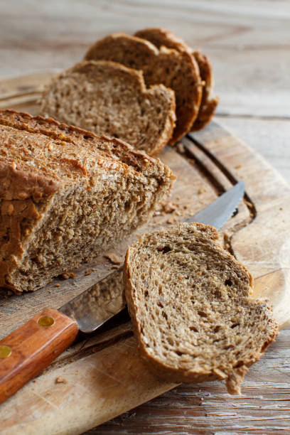 istock Wholemeal Bread on a Wooden Table 877703760