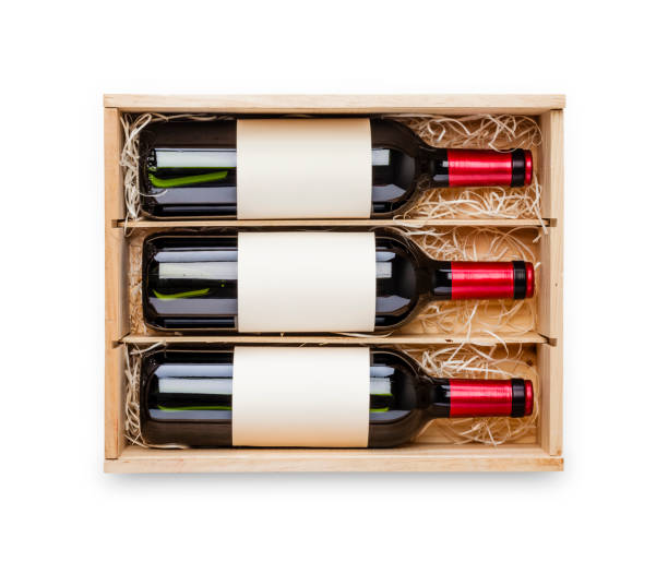 opened wooden box with three red wine bottles inside it isolated on white background - wine wine bottle box crate imagens e fotografias de stock