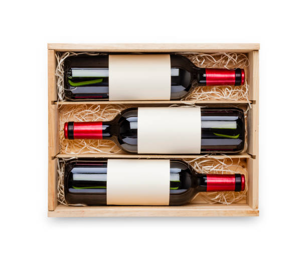 opened wooden box with three red wine bottles inside it isolated on white background - wine wine bottle box crate imagens e fotografias de stock