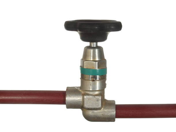 istock Water tap with black handle and red pipes isolated on white background. 877714610