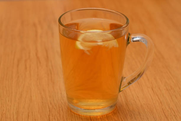 istock A cup of black tea with lemon on the table 877718916