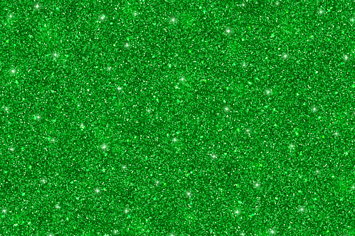 Green glitter particles texture, abstract holiday background