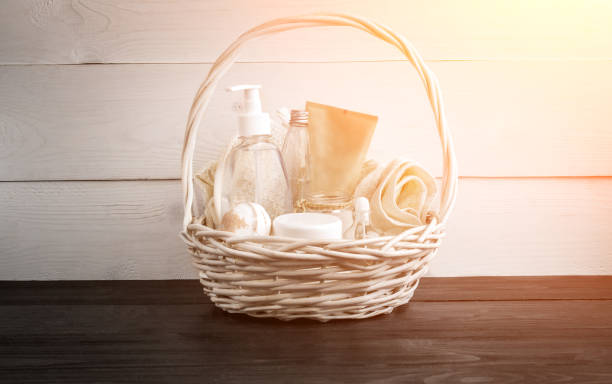 istock Wicker basket with spa treatments on table. Sun flare 877745184