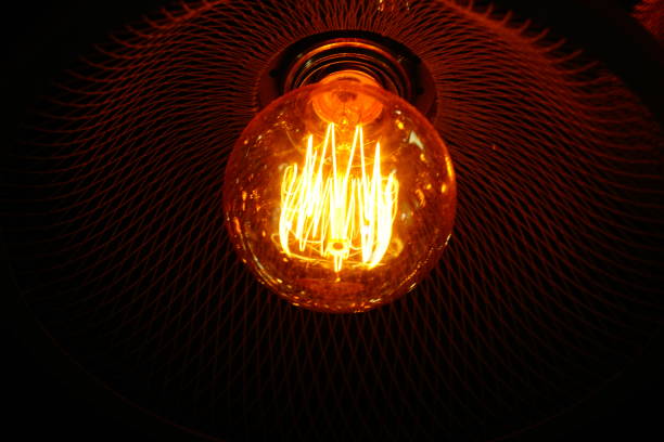 istock Vintage bulb  lamps in loft interior 877745230