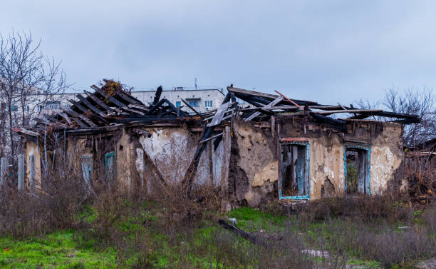 istock Poverty and unemployment. Ruined old-fashioned house 877753962