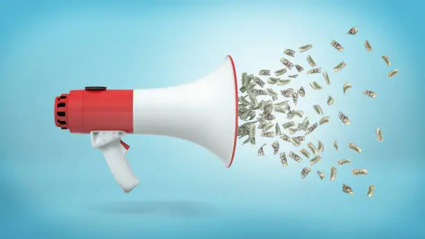 Photo of 3d rendering of a large red and white megaphone in a side view with many dollar bills flying out of it on a blue background.