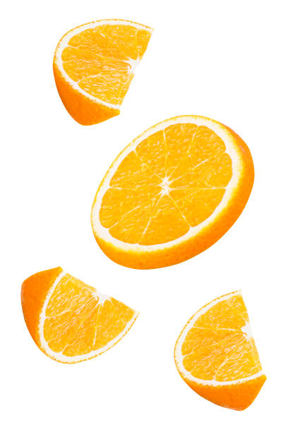 istock Isolated falling orange fruits pieces. 877759916