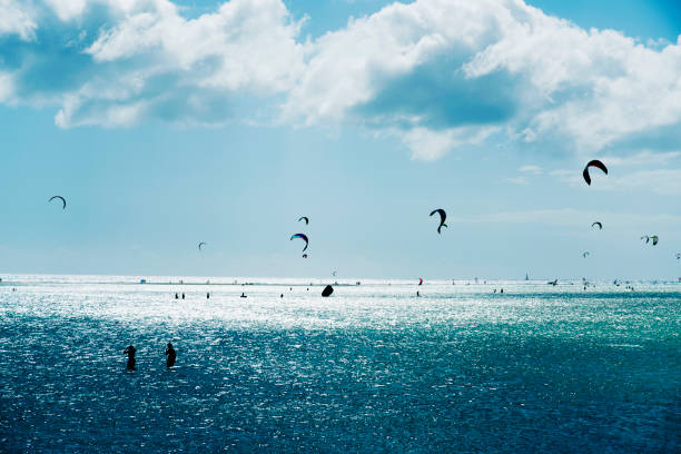 some unrecognizable kitesurfers in the popular Sotavento Beach in Fuerteventura, Canary Islands, Spain