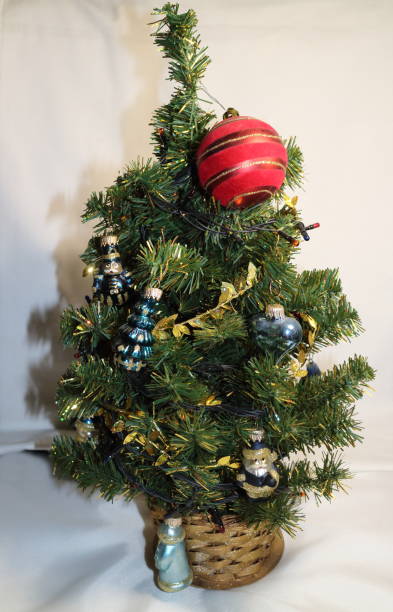 istock Christmas tree with small toys and a red ball 877760256