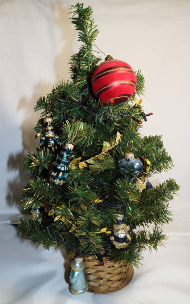 istock Christmas tree with small toys and a red ball 877760258