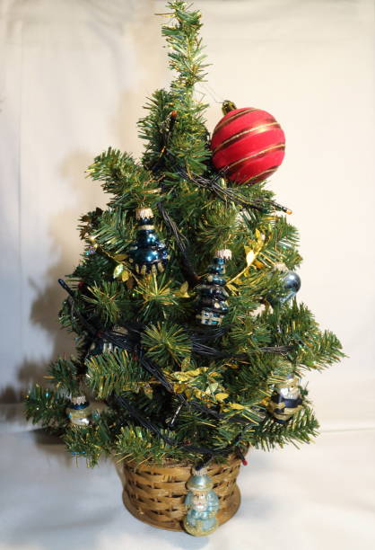 istock Christmas tree with small toys and a red ball 877760298