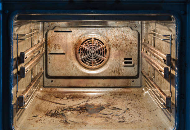 dirty open oven - messy kitchen, compulsive hoarding syndrom - contemporary indoors lifestyles domestic room imagens e fotografias de stock