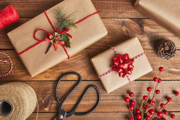 istock Christmas presents on rustic wooden background 877770532