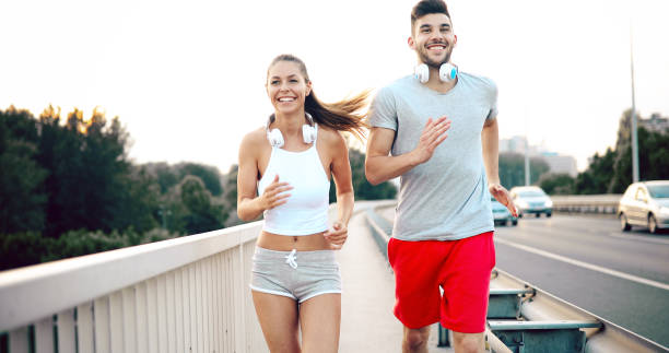 istock City running couple jogging outside 877771350